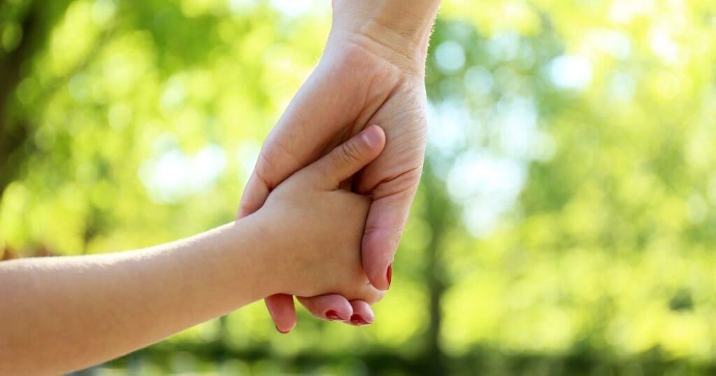 Mom and daughter holding hands. Are eating disorders genetic?