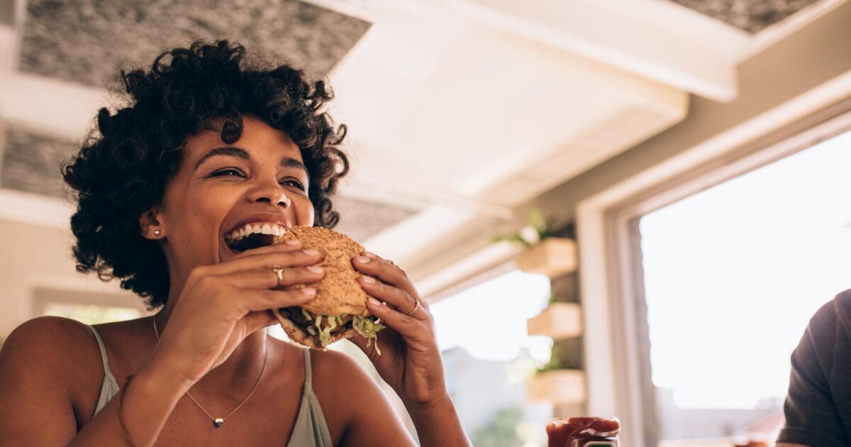 woman enjoying food after finding motivation for eating disorder recovery